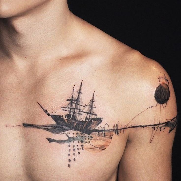 a man with a ship tattoo on his chest