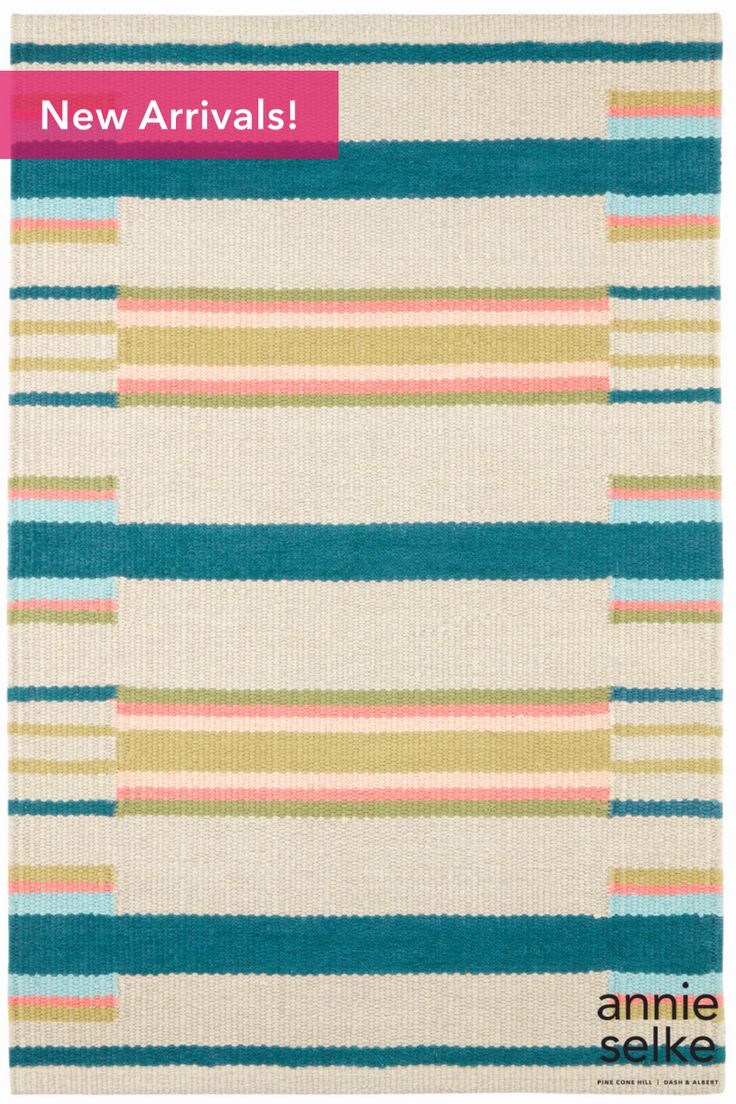 an area rug with multicolored stripes and the words new arrivals written on it