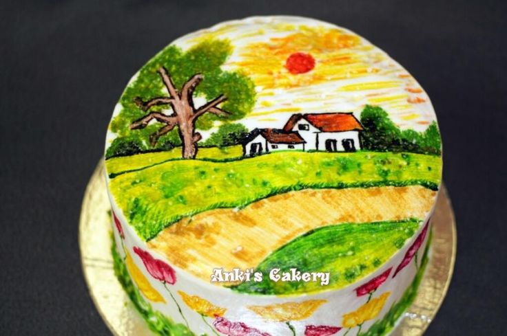 the cake is decorated with an image of a country house and tree on it's side