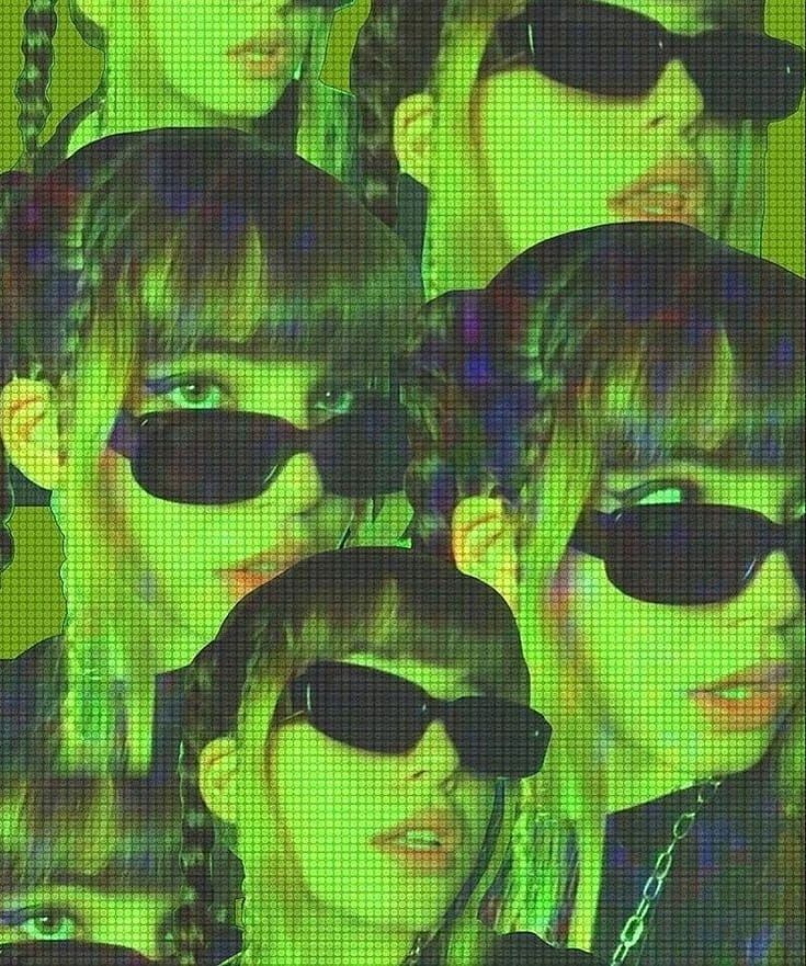 a group of people with sunglasses on their faces