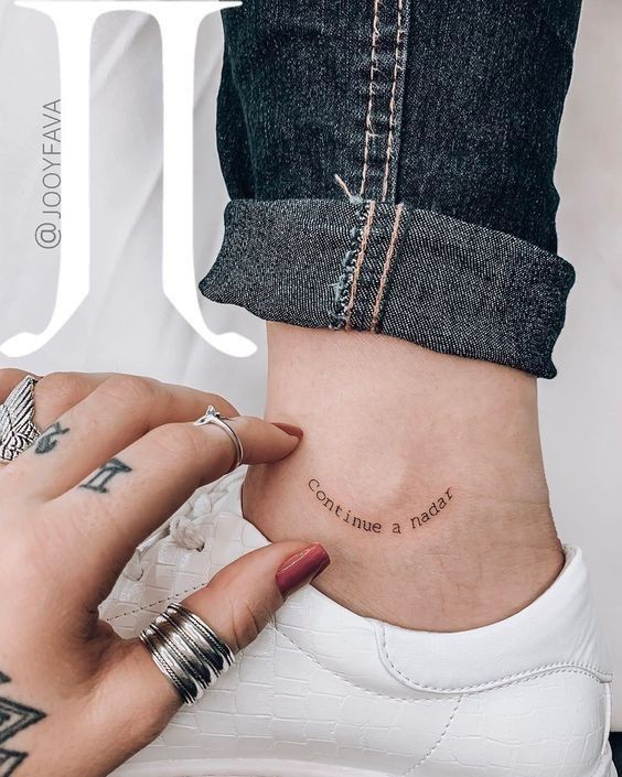 a woman's ankle tattoo with the words i love you written in cursive font