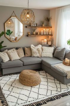 a living room with grey couches and white rugs on the floor in front of a large window