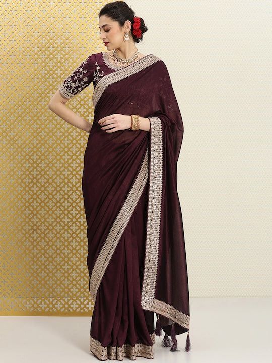 Burgundy and gold-toned sareeSolid solid saree with woven design borderHas sequinned detailThe saree comes with an unstitched blouse pieceThe blouse worn by the model might be for modelling purpose only. Check the image of the blouse piece to understand how the actual blouse piece looks like. Solid Saree, Western Kurtis, Saree Sale, Organza Saree, Burgundy And Gold, Woven Design, New Launch, Salwar Suits, Blouse Piece