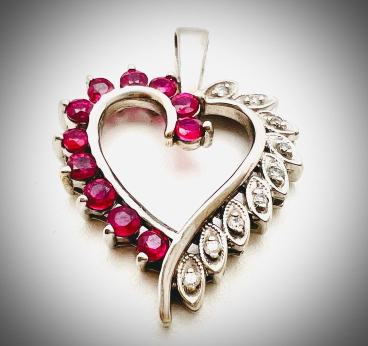 Vintage 14K White Gold Ruby Diamond Heart Pendant This beautiful vintage heart shape pendant is a perfect gift for your loved one for any special occasion or holiday!  Total Pendant Weight: 2.84g Total Diamond: 1.00ct Pendant Length: 26.80mm Pendant Width: 19.59mm Necklace not included but if needed an additional charge of $150 will be made.  Item will be placed in a gift box. * Valentine's Day Heart Cut Necklace With 17 Jewels, Heart-shaped Necklace With Prong Setting For Wedding, Elegant Heart Necklace With Prong Setting For Valentine's Day, Elegant Prong-set Heart Necklace For Valentine's Day, Heart-shaped Wedding Necklace With Prong Setting, Heart Shaped Wedding Necklace With Prong Setting, Gift Heart Necklace With Prong Setting, Vintage Heart Jewelry With Diamond Accents, Vintage Heart-shaped Jewelry With Diamond Accents