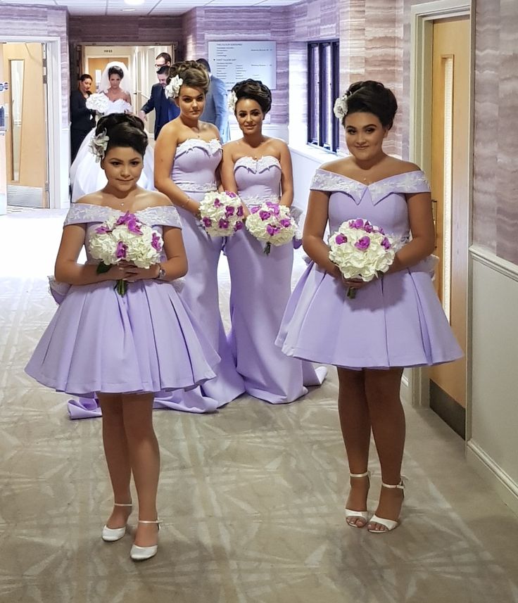 the bridesmaids are all dressed in lavender dresses