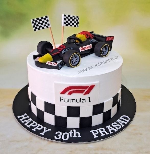 a birthday cake with a racing car on top