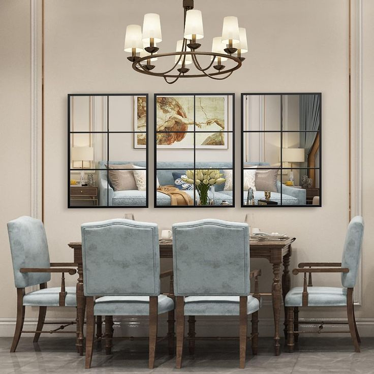 a dining room table and chairs with mirrors on the wall