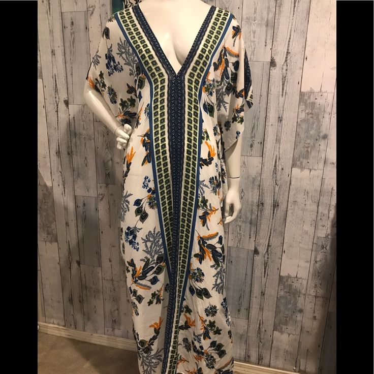 Gorgeous Print On This Caftan. Deep V Neck, Side Slits. 100% Vicose Pit To Pit Aprox 27” Shoulder To Hem 53” Excellent Condition C-18 Casual Maxi Dress With Floral Print And Kimono Sleeves, Casual V-neck Kimono With Boho Print, Patterned Long Maxi Dress For Vacation, Floral Print Maxi Length Summer Kimono, Floral Print Long Kaftan In Free Size, Patterned Long Kaftan For Vacation, Floral Print Long Kaftan Free Size, White Floral Print V-neck Kaftan, Floral Print Long Free-size Kaftan