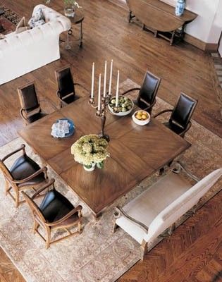 an overhead view of a dining room table with chairs and centerpieces on it