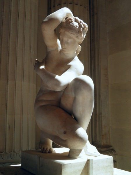 a statue is sitting on a pedestal in front of a building with columns and pillars