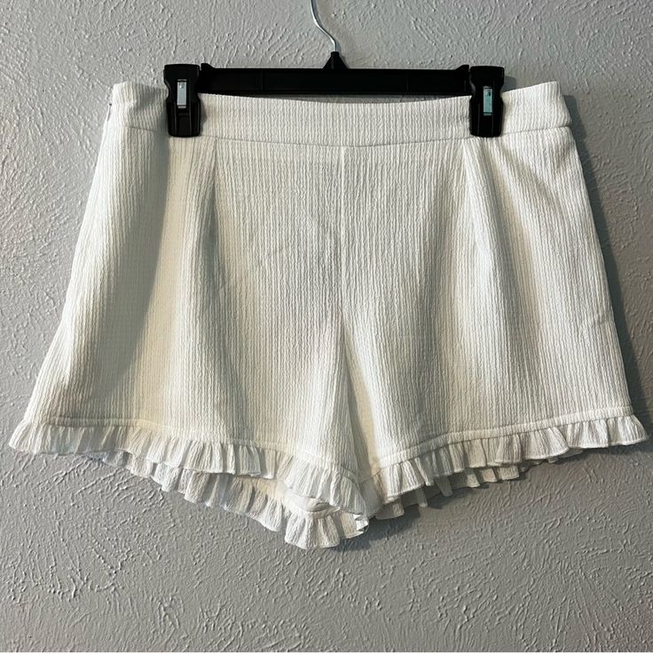 Shein White Ruffle Shorts. Size Medium And Never Worn! Pet And Smoke Free Home. Will Accept Reasonable Offers! White Ruffled Bottoms For Spring, Feminine Cotton Bottoms For Brunch, Feminine Short Length Bottoms For Brunch, Feminine Bottoms With Ruffle Hem For Vacation, Summer Ruffle Shorts For Brunch, Summer Brunch Shorts With Ruffles, Chic Ruffled Shorts For Summer, Stretch Bottoms With Ruffles For Day Out, Chic Ruffled Summer Shorts