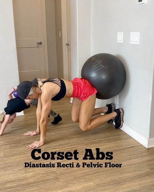 two people doing push ups with an exercise ball