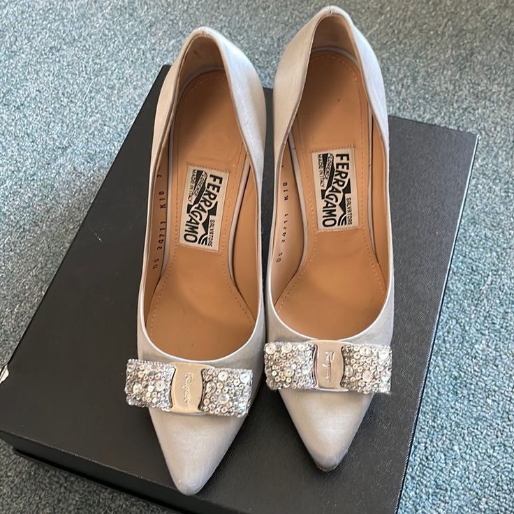 This Pair Is Maker Of Silk Materials And Almost In A Perfect Condition. I Only Wore It A Couple Of Times For Events. My Shoe Size Is Between 6&1/2 To 7. This Pair Will Fit For Us Shoe Size Between 7&1/2 To 8. I Did My Best To Show The Length (See Pic). Metallic Silver Heels With 4-inch Heel For Formal Occasions, Luxury Metallic Silver Pointed Toe Heels, Classic Silver Heels With 4-inch Heel, Formal Metallic Silver Leather Heels, Metallic Silver Pointed Toe Heels For Wedding, Classic Silver High Heels, Chic Metallic Silver Heels For Evening, Metallic Silver 4-inch Heels For Formal Occasions, Elegant Silver Heels With Pointed Toe