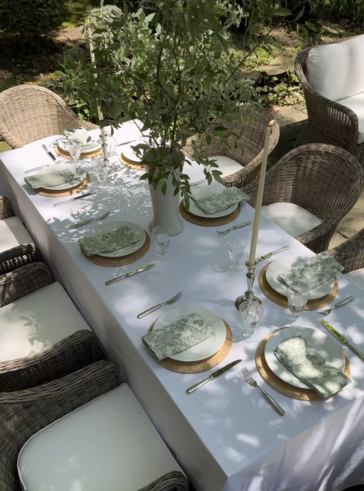 the table is set with plates and silverware for an elegant dinner party or celebration