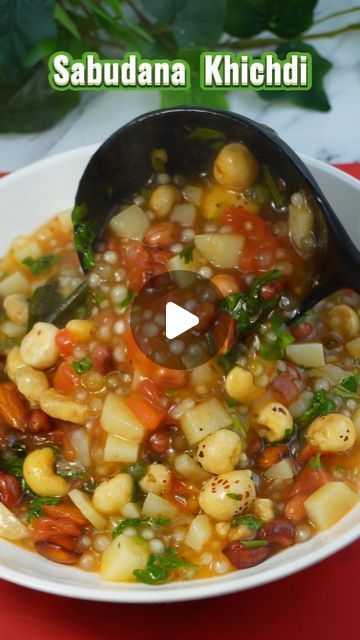 a white bowl filled with food on top of a red table