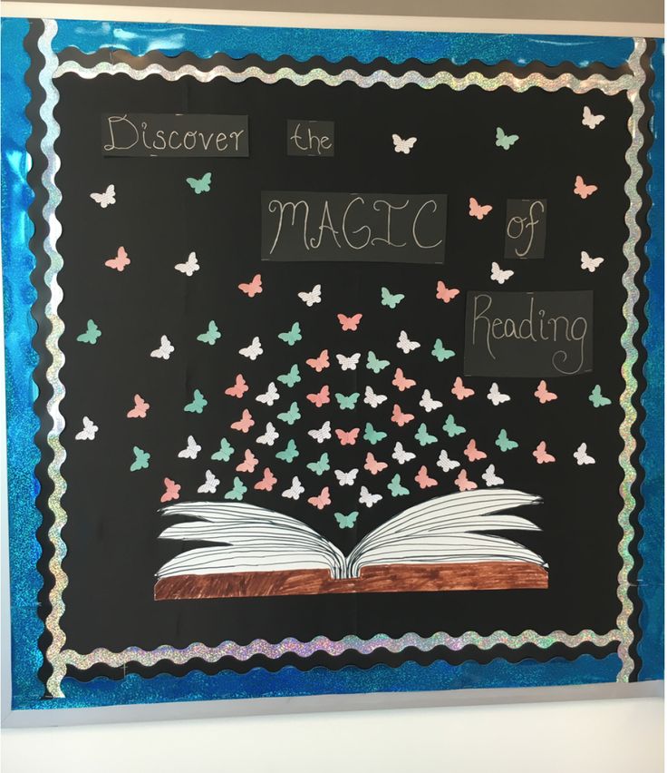 a chalkboard with butterflies and an open book on it that says, discovering the magic of reading