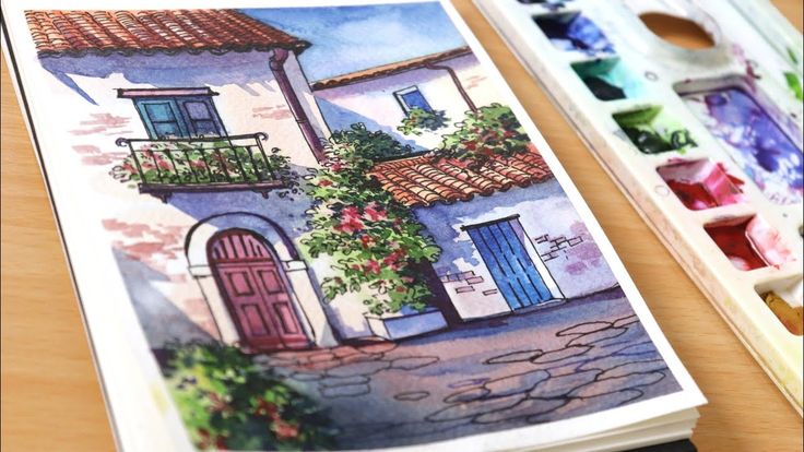 a watercolor painting of a house with flowers on the balcony and paintbrushes next to it