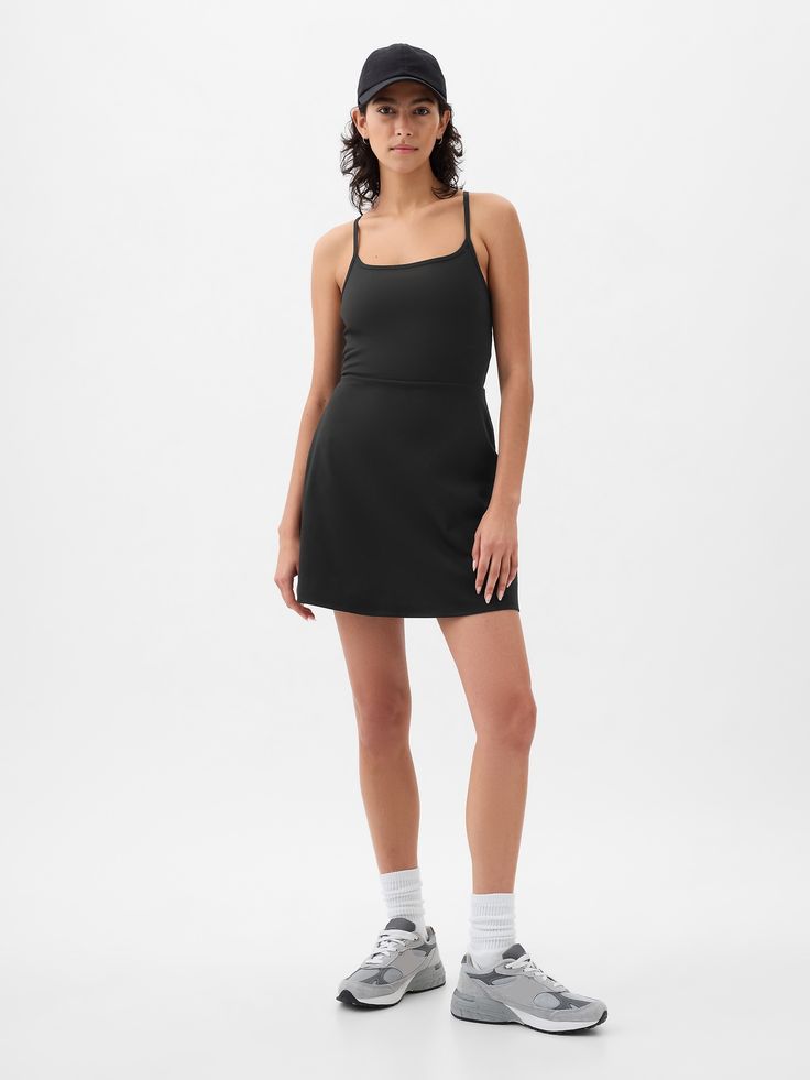 Soft brushed jersey exercise dress.  Moisture Wicking helps keep your skin dry.  Stretch allows freedom of movement while providing superior shape retention.  Square neck.  Adjustable spaghetti straps.  Built-in shorts.  This exercise dress is made with 79% recycled polyester.  Using recycled materials helps to conserve resources and reduce waste.  This product was made in a factory that invests in gender equality and women’s empowerment.  Through RISE Reimagining Industry to Support Equality) a Workout Dress Outfit, Athletic Dress Outfit, Exercise Fits, Black Tennis Dress, Capsule Style, Exercise Dress, Work Fits, Athleisure Dress, Mom Fashion