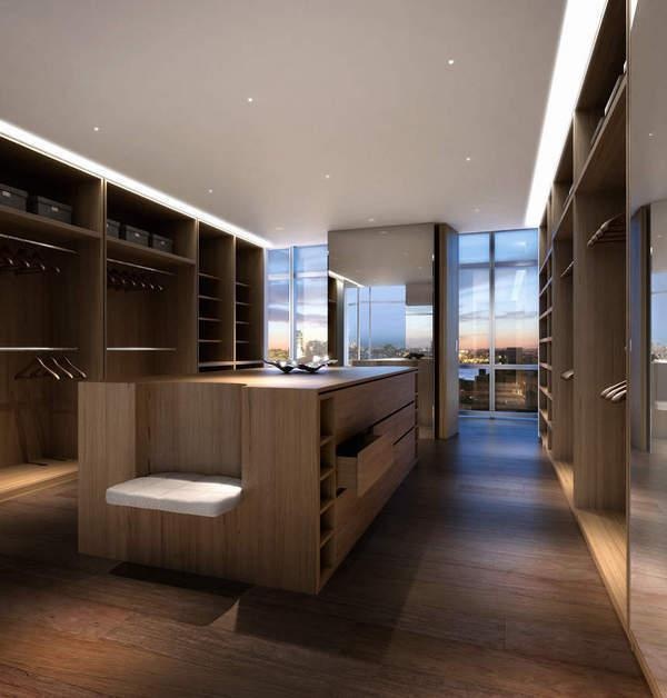 an empty kitchen with wooden cabinets and white stools in front of large windows overlooking the city