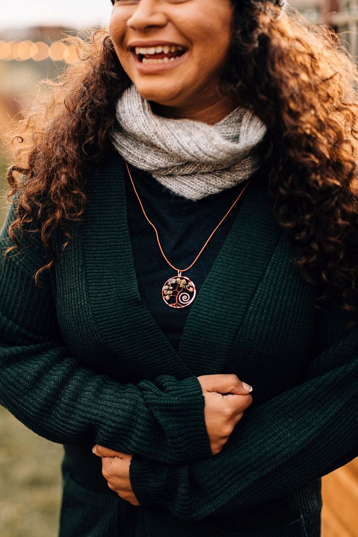 A wonderful gift for a trendsetting tree-lover, the Twisted Tree necklace features a glass bead and silver- and copper-colored wire pendant on a camel leather cord. This hand-beaded necklace combines traditional artistry with innovative design, providing sustainable income for women makers working with Creaciones Chonita in Santiago Atitlan, Guatemala. Spiritual Fair Trade Jewelry, Nature-inspired Fair Trade Jewelry For Gifts, Fair Trade Nature-inspired Jewelry For Gifts, Brown Fair Trade Necklace Gift, Fair Trade Brown Necklace For Gift, Earthy Fair Trade Jewelry As Gift, Earthy Fair Trade Jewelry Gift, Spiritual Copper Beaded Necklaces As Gift, Fair Trade Pendant Jewelry For Gifts