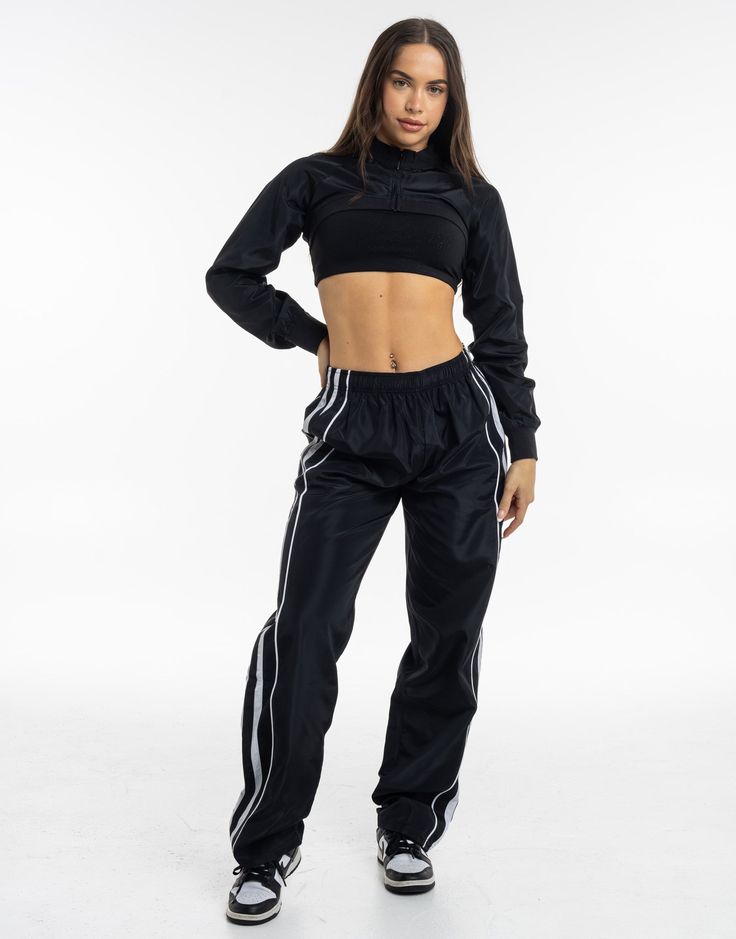 Meet the High Cut Hoodie, the perfect layering piece that deserves to be a part of the all-year rotation. The ultra cropped length is the High Cut Hoodie's best attribute, great for showing off your sportsbra and/or bikini. Add in a hoodie and you've got a top that can provide style and warmth - Super soft cotton/polyester blend - In-trend ultra cropped silhouette - Large hood - Designed to flatter every size - Worn by our inhouse team for the perfect fit 62% Cotton, 38% Polyester Bella is weari Black Nylon Hooded Activewear, Black Hooded Nylon Activewear, Black Nylon Gym Windbreaker, High Stretch Black Crop Top For Streetwear, Black High Stretch Crop Top For Streetwear, Winter Tracksuit For Gym, Winter Sporty Tracksuit For Gym, Winter Gym Tracksuit, Black Nylon Track Jacket For Gym