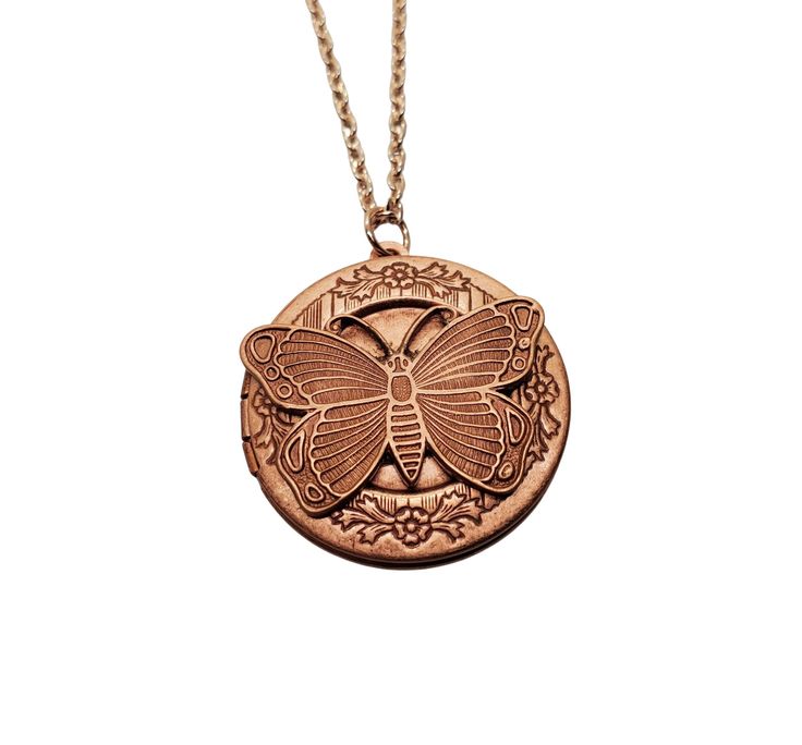 "A pretty detailed rose gold locket has been set with an oxidized rose gold butterfly. The locket suspends from a lead and nickel free matching link chain. Your necklace will come in a pouch for gifting and storage. Measures: 24\" long Locket: 1 1/4\" in diameter" Antique Gold Medallion Necklace Gift, Antique Gold Medallion Necklace As Gift, Antique Gold Brass Medallion Necklace As Gift, Vintage Medallion Locket Necklace As Gift, Antique Gold Medallion Necklace With Coin Pendant For Gift, Bronze Medallion Necklace With Coin Pendant As Gift, Antique Gold Brass Medallion Necklace For Gift, Gift Antique Gold Brass Medallion Necklace, Antique Gold Brass Medallion Necklace Gift