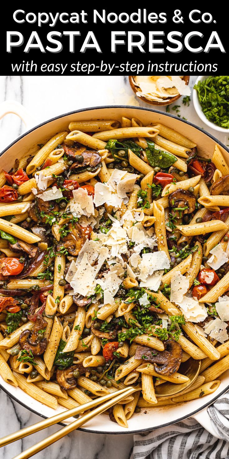 pasta with mushrooms, spinach and parmesan cheese in a skillet on a marble surface