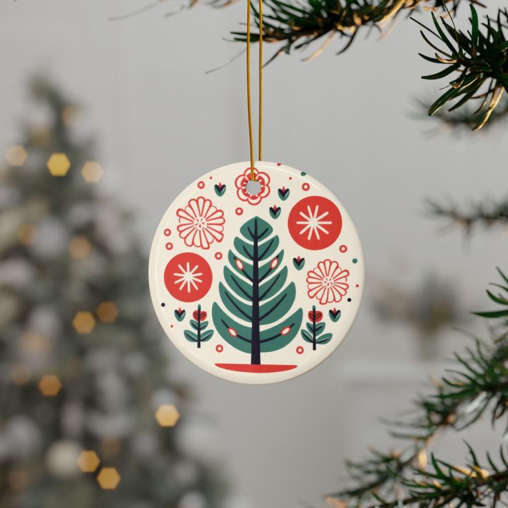 Create stunning decorations for the holiday season and beyond with these customizable ornaments. Made with durable ceramic, these ornaments feature a two-sided print. Offer 4 shapes and bundles of 1, 3, 5, 10 pieces to cover all your gift giving needs. .: Same design printed front and back .: Material: 100% Ceramic .: Available as a single ornament and in bundles of 3, 5 or 10 pieces .: Glossy finish .: Four shapes to choose from .: Includes gold string for hanging Folk Christmas Tree, Ceramic Christmas Trees, Ceramic Christmas, Tree Ornaments, Christmas Tree Ornaments, Ornament Decor, Folk Art, Holiday Season, Seasonal Decor