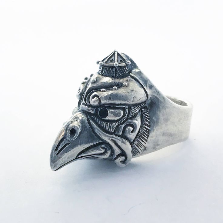 "Jewel made entirely by hand by the Italian artisan Gianmarco Fontana. This ring made of Silver 925 depicting Kerasu Tengu is part of the \"Japanized\" collection. The tengus take various forms, but generally they are represented as bird-men, endowed with a long prominent nose or even of beak, with wings on the head and often red hair; the less powerful ones, karasu tengu (烏 天狗?), kotengu (小 天狗?) or konohatengu (の 葉 天狗?) are portrayed as more similar to birds. The face may be red, green or black Ceremonial Symbolic Hand Cast Rings, Adjustable Symbolic Carved Rings, Symbolic Handmade Engraved Ring, Symbolic Handmade Engraved Ring Collectible, Ceremonial Artisan Sterling Silver Rings, Artisan Sterling Silver Rings For Ceremonial Occasions, Artisan Carved Rings, Unique Carved Sterling Silver Rings, Unique Sterling Silver Rings For Ceremonial Occasions