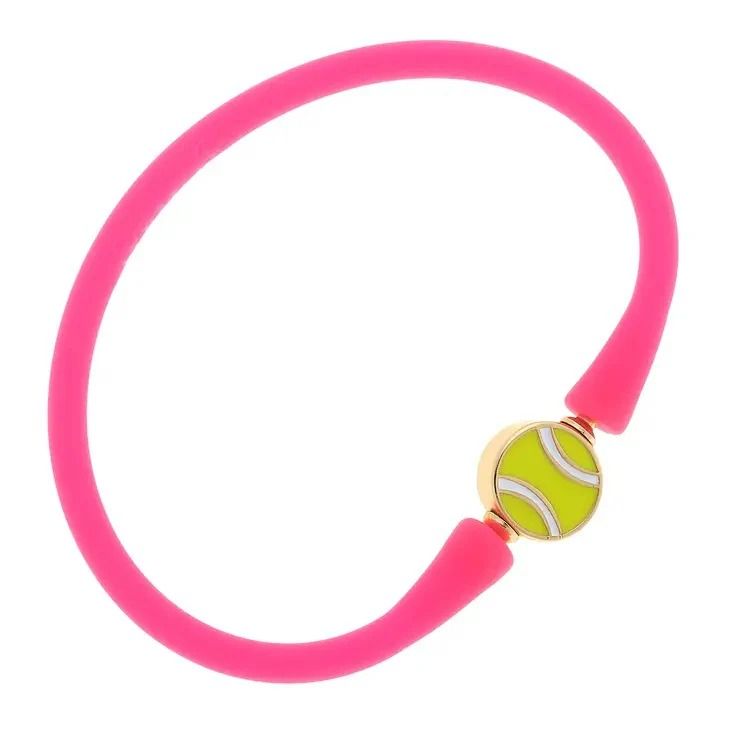 a pink bracelet with two tennis balls on it