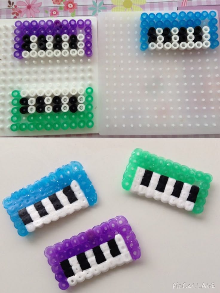 three pieces of plastic bead with piano keys on them