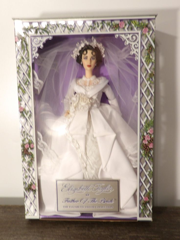 a barbie doll in a wedding dress and veil