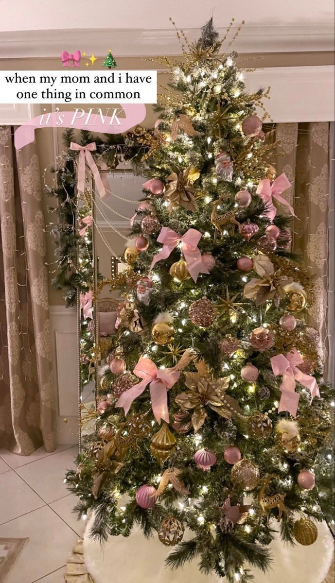 a decorated christmas tree with pink and gold ornaments