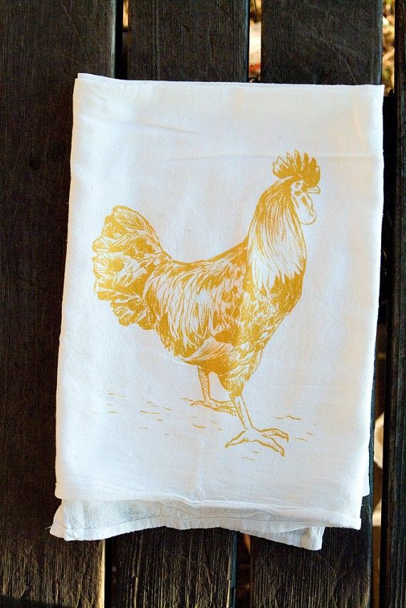 a white towel with a yellow rooster on it