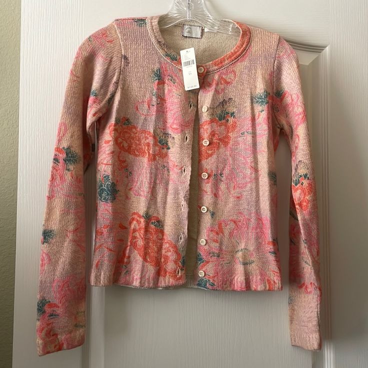 Pretty Pink, Orange And Green Floral Cardigan. Measures 21 Inches Long And 18 Inches Across From Armpit To Armpit When Flat And Buttoned. Brand Nwt! Pink Crew Neck Casual Cardigan, Feminine Pink Cardigan For Spring, Pink Fitted Crew Neck Cardigan, Feminine Pink Spring Cardigan, Casual Pink Cardigan For Spring, Pink Floral Print Top For Winter, Spring Fitted Cardigan With Floral Print, Pink Crew Neck Cardigan For Layering, Pink Floral Print Sweater For Spring