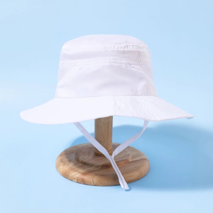 Kids Bucket Hat | Adjustable - Kids Hats - Poshinate Kiddos Baby & Kids Store - View of white hat with strap. Spring Bucket Hat With Uv Protection And Adjustable Fit, Adjustable Fit Summer Hat Upf 50+, Solid Hats With Uv Protection And Adjustable Fit, Solid Brimmed Sun Hat With Uv Protection, Adjustable Solid Bucket Hat For Summer, Adjustable Fit Solid Color Summer Bucket Hat, Solid Sun Hat With Uv Protection And Curved Brim, Playful Adjustable Sun Hat With Upf 50+, Summer Hat With Uv Protection