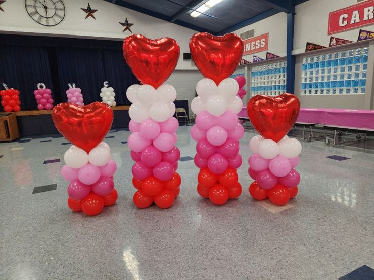 balloons are arranged in the shape of hearts