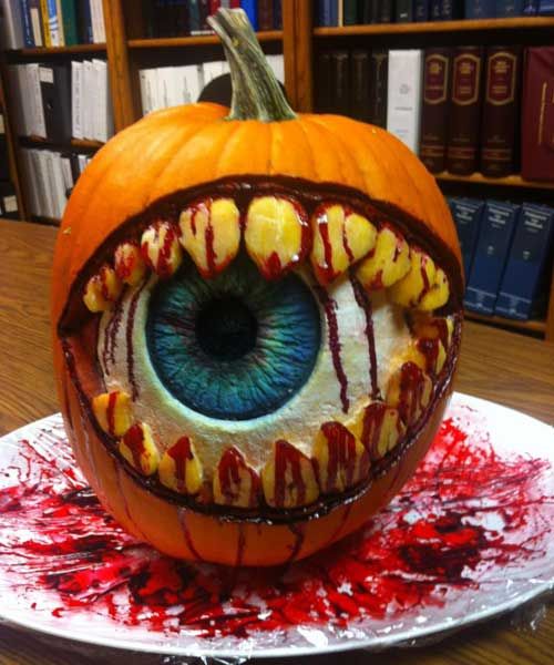 a pumpkin with an eye painted on it