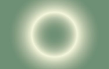 a white circle is shown in the middle of a green background with light coming from it