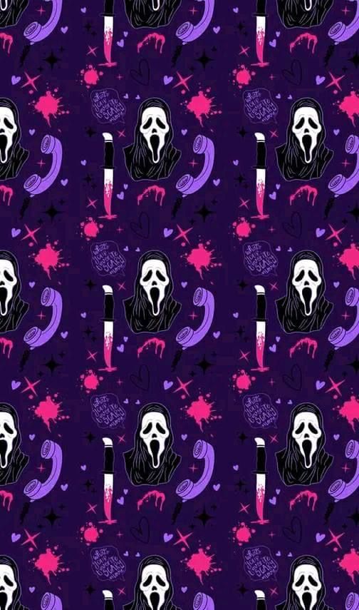 a purple and black background with skulls, stars, and moon shapes on it's surface