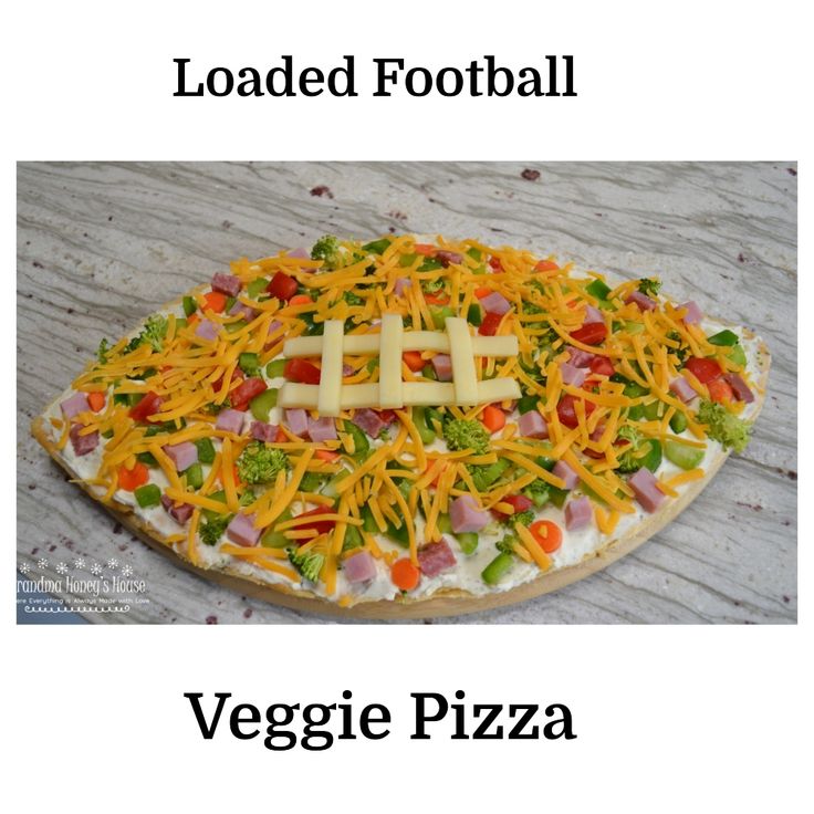 a pizza topped with cheese and veggies on it