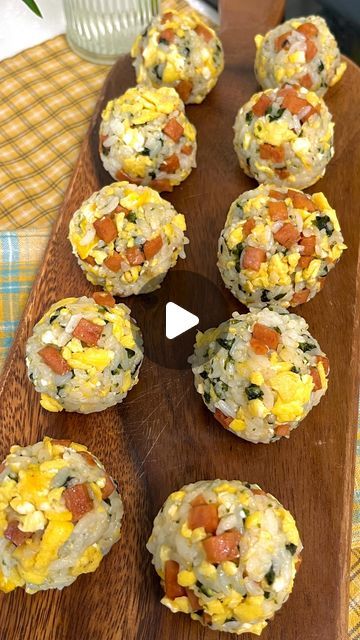 several muffins are arranged on a wooden board