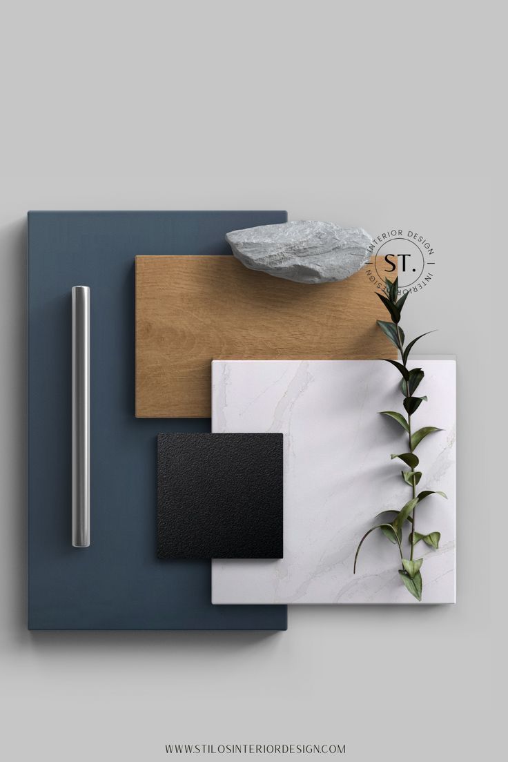 an assortment of different materials are displayed on a table with a plant in the corner