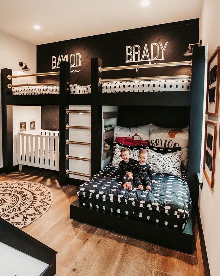 a kid's bedroom with bunk beds and pictures on the wall above them,