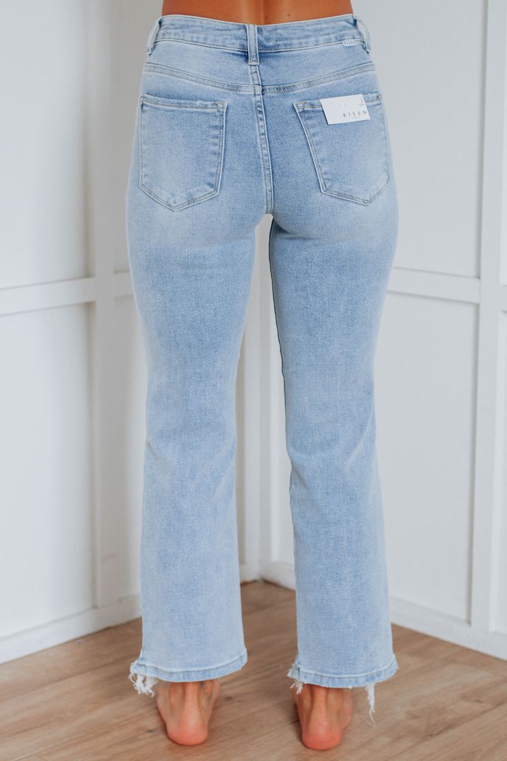 Details: Millie Risen Jeans High Rise Minimum Distressing Light Fading/Whiskering Straight Leg with Slight Flare Raw Edge Frayed Hems Zip Fly Button Closure Great Stretch Available in 2 Washes Rise: 10" Inseam: 27.5" Leg Opening: 16" Material: 73% Cotton, 25% Polyester, and 2% Spandex We are recommending true to size! 1XL - Sizes (16-18) 2XL - Sizes (18-20) 3XL - Sizes (20-22) Risen Jeans, Athleisure Shorts, Cute Jeans, Light Wash Jeans, Shoes With Jeans, Outfit Inspo Fall, Cardigan Jacket, Creative Fashion, High Jeans