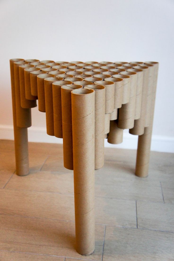 a table made out of wooden sticks on the floor