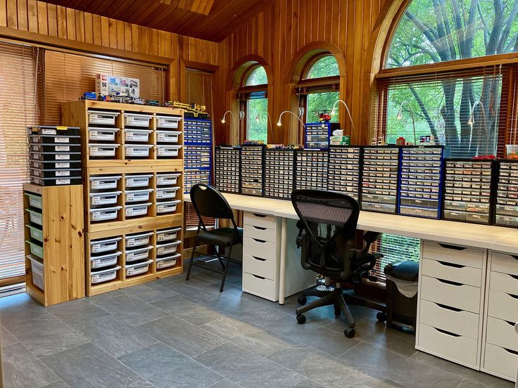 a room filled with lots of drawers and desks