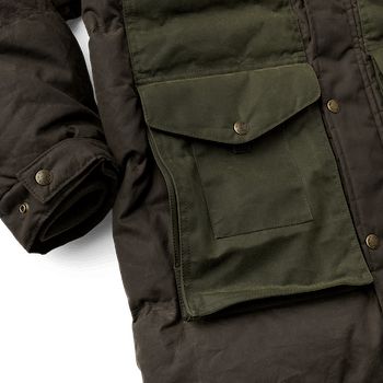 The Down Cruiser Parka is based on our proven exceptionally warm Down Cruiser, with added length and an attached hood for extended coverage and cold-weather protection. Responsibly-sourced goose down, the warmest and lightest insulation found in nature, traps body heat like nothing else can. Our signature Oil finish Cover and Shelter Cloths keep the rain and snow out so the down insulation can maintain its insulating loft. The Cruiser Parka’s shell is built with Cover Cloth, our lightest-weight oil finish waxed cotton, and reinforced in wear areas with slightly heavier Shelter Cloth for durability. The large 3-way lower-front pockets feature layered utility pockets and wool-lined handwarmer pockets. Chest pockets are hidden beneath a cape that provides additional weather protection, with a Duck Down Parka For Fall Outdoor Activities, Winter Duck Down Outdoor Parka, Functional Hunting Outerwear With Pockets, Winter Parka With Padded Collar For Outdoor Activities, Winter Insulated Parka For Outdoor, Winter Outdoor Insulated Parka, Outdoor Down Outerwear With Padded Collar, Winter Hunting Utility Outerwear, Utility Winter Hunting Outerwear