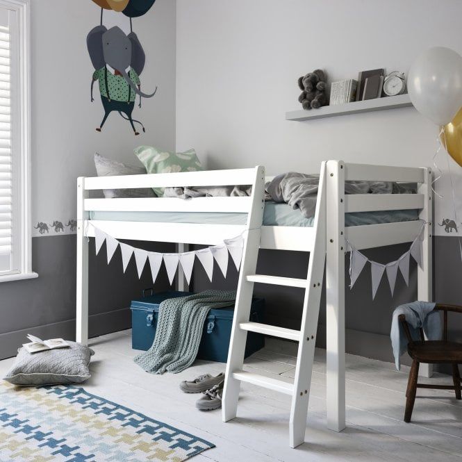 a child's bedroom with bunk beds and balloons