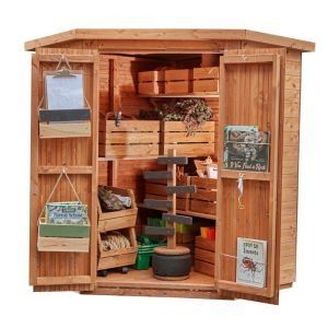 a wooden storage shed filled with lots of items